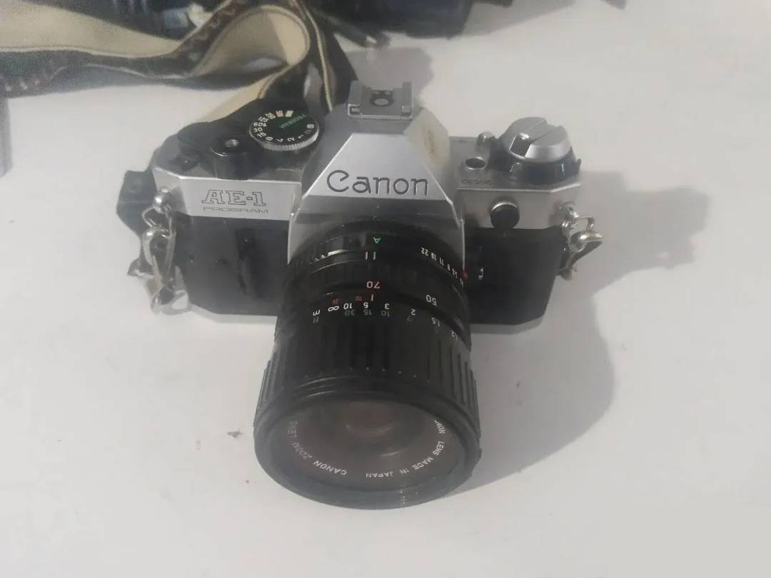 Canon AE-1 camera with lens