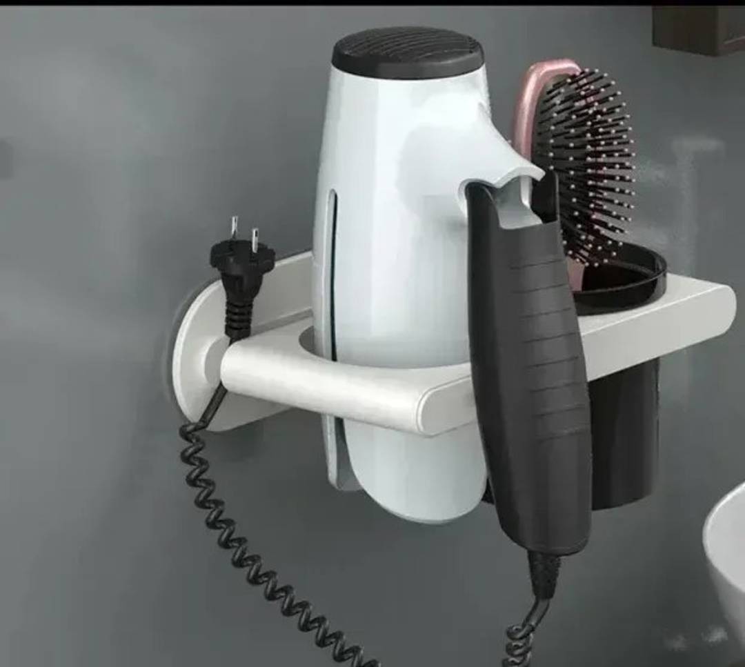 Wall-mounted hair dryer holder with accessory cup
