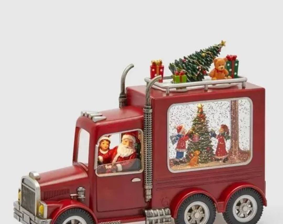 Weihnachtsdekoration: musikalischer Lastwagen mit Weihnachtsmann